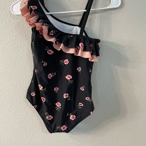 This is a very comfortable black floral swimsuit.